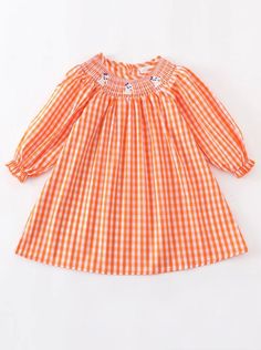 Toddler girl orange Halloween dress with ghost smocking. Long sleeve dress with back button closures. Hand wash.  Matching baby girl romper also available! Long Sleeve Cotton Smocked Dress For Fall, Cotton Long Sleeve Dress With Smocked Back, Cute Long Sleeve Smocked Dress With Smocked Cuffs, Cute Long Sleeve Smocked Dress For Spring, Ghost Dress, Embroidered Ghost, Dresses Halloween, Ghost Dresses, Black Halloween Dress