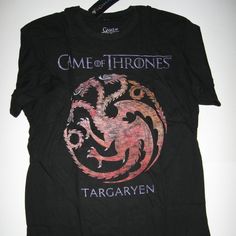 ~New With Tag~ ~Licensed Game Of Thrones Tee T Shirt~ ~Targaryn~House Of Fire & Blood~ ~Three Headed Dragon~ ~Adult Size Medium~ ~Super Soft Black Light Weight Cotton For Comfort~ ~Perfect For Those Warm Summer Nights~ ~Thank You For Viewing This Item~ ~Please Look At All The Items In My Closet~ Game Of Thrones Bachelorette Shirts, Three Headed Dragon, Dolman Shirt, Oversize Knit, Giraffe Print, Tie Dye T Shirts, Pink Shirt, Golf Shirts, Soft Black