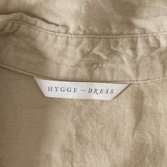 Logo that says Hygge Dress on a white label inside a shirt Dress Label Tag Design, Linen Branding Logo, Clothing Label Inspiration, Clothing Label Design Ideas Branding, Clothing Brand Label Design, Fashion Tags Label Design, Fabric Label Design, Clothes Label Design Tags