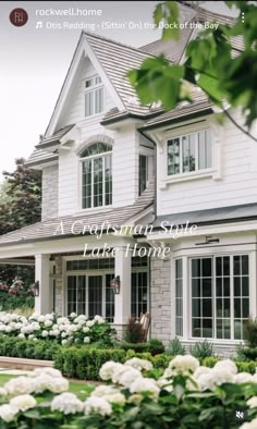 a house with white flowers in front of it and the words rockwood homes written below