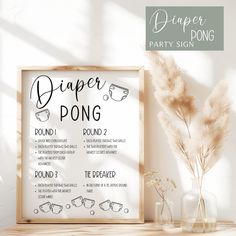 a sign that says diaper pong on it next to some vases and flowers