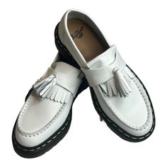 Dr.Martens Adrian Ys Smooth White 27431100 Leather Tassle Loafer Size W 8/ M 7 Dr. Martens Adrian Ys Smooth White Leather Tassel Loafers Are A Comfortable And Stylish Choice For Men's Casual And Activewear. These Pull-On Loafers Feature A Round Toe Shape And Rubber Outsole For Durability And Comfort. The Leather Upper And Lining Material Add A Touch Of Luxury To The Design. The Tasseled Accents And Solid Pattern Make Them Perfect For Going Out. Available In Us Size 8, Uk Size 7, And Eu Size 39, White Slip-on Tassel Loafers For Formal Occasions, White Tassel Loafers With Leather Sole And Round Toe, White Tassel Loafers With Rubber Sole For Formal Occasions, White Tassel Loafers With Brogue Detailing For Formal Occasions, White Round Toe Casual Tassel Loafers, White Leather Tassel Loafers For Spring, White Casual Tassel Loafers With Round Toe, White Leather Sole Tassel Loafers For Work, White Leather Loafers With Tassels