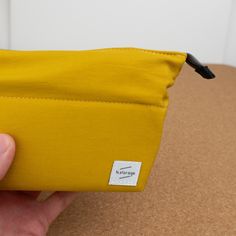 The Kokuyo N-Storage features a zipper closure that when open, rolls back allowing you to see all of its contents. Each pocket is at a diagonal keeping things easy to find and accesible. This pencil case has a medium holding capacity. The interior of the pencil case has a square deep pocket which can hold up to 13 pens. There is a shallow diagonal pocket perfect for holding an eraser, correction tape, or other small tool. Then finally there is a deep long rectangular pocket, perfect for holding Multifunctional Rectangular Zipper Pouch Stationery, Multifunctional Pencil Case With Zipper, Multifunctional Stationery With Pen Slots, Foldable Pouch Pencil Case For Daily Use, Functional Pouch With Pen Slots For Personal Use, Modern Rectangular Pencil Case With Zipper Closure, Functional Zipper Closure Pencil Case For Personal Use, Rectangular Stationery With Pen Slots For Everyday Use, Functional Rectangular Pencil Case With Zipper Pocket