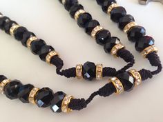 "Hecho con crystal Importado negro de 10mm x 8mm sobre Hilo de pulsera negro, practica mente inrompible, Los crystales son importados de Republica Checa y mezclados con rhondelles bañados en Oro con brillantes de crystal alrededor. La Cruz Es de metal pintada en negro hecha en Italia mide 1\" pulgada de alto y tiene el simbolo de La Cruz De San Benito , protector contra el diablo, la muerte y exorcismos. Perfecto para llevarse be el cuello muy a la moda, Es todo en negro. El aro del Rosario mide Adjustable Black Spiritual Rosary, Black Rosary Bracelet With 8mm Beads For Jewelry Making, Adjustable Black Rosary With 8mm Beads, Black Rosary Necklace, Black Rosary, Chicanas Tattoo, Rosary Necklace, Rosary, Hand Made