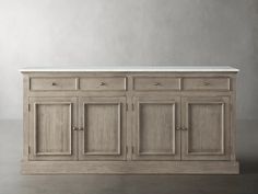 a large wooden cabinet with white marble top