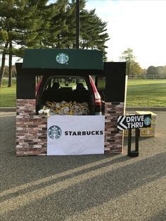 a starbucks truck with its trunk full of food