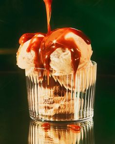 an ice cream sundae with caramel sauce drizzled on it's top