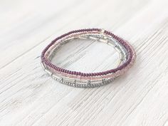 This minimalist bracelet set is so dainty and would make a nice gift. Stack these together, with other bracelets, or wear them by themselves! They are perfect for everyday wear! ∙ ∙ ∙ ∙ ∙ ∙ ∙ ∙ ∙ ∙ ∙ ∙ ◆ MATERIALS ◆ * High-Quality Beading Elastic * Seed Beads of Various Colors * Silver Bugle Beads ∙ ∙ ∙ ∙ ∙ ∙ ∙ ∙ ∙ ∙ ∙ ∙ ◆ SIZES ◆ This bracelet set is made to order so you can order it in whatever size you need. If you need a custom size please let me know. ∙ ∙ ∙ ∙ ∙ ∙ ∙ ∙ ∙ ∙ ∙ ∙ ◆ FINDING THE R Beading Jewelery, Bracelet Minimalist, Purple Bracelet, Seed Bead Bracelet, Dainty Bracelet, Bugle Beads, Stackable Bracelets, Minimalist Bracelet, Dainty Bracelets