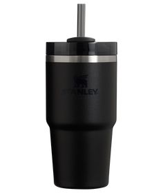 a black tumbler cup with a straw sticking out of it's top and the words stanley on it