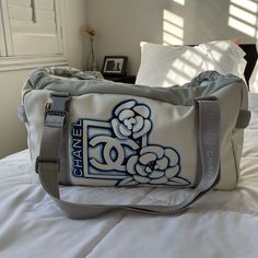 Rare Find! Chanel Sports Camellia Duffle Bag In Nylon Like Material With Grey Mesh Contrast. Rubber Handles And Nylon Straps. Straps Are Convertible And Adjustable! Condition: Excellent, Light Signs Of Use/Wear. Mainly Has Some Darkening On The Edges Due To The Natural Wear Of White Nylon. Some Marks Here And There But Not Tears. Please Review Photos And Video And Keep In Mind This Is Preloved So There Will Be Signs Of Use. Chanel Bags, Lighted Signs, Chanel Bag, Convertible, Duffle Bag, Handles, Chanel, Bag Lady, Mesh