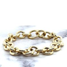 ➣ High quality 14K Yellow Gold 12mm Round Link Bracelet with Push Lock Clasp, 7.5" Real Gold Bracelet, Chuncky Circle Link Bracelet, Women ➣ MATERIAL: 14K Yellow Gold  ➣ Closure: Push-in   ➣ Weights:  Bracelet - 7.5" - 9 grams Necklace - 18" - 19.6 grams  ◈ Please note that weights are approximate. ➣ If you need a specific length, please message us. Explore more gold bracelets. https://www.etsy.com/shop/MarinaMJewelry?ref=seller-platform-mcnav&search_query=gold+bracelet ➣ SHIPPING: ◈ We always o Gold Chunky Chain Bracelet, Gold-tone Chunky Chain Bracelet With Oval Links, Gold-plated Chunky Chain Bracelet With Oval Links, Gold-tone Solid Link Round Bracelet, Gold-tone Solid Link Gold-plated Bracelet, Yellow Gold-plated Bracelet With Toggle Clasp, Real Gold Bracelet, Gold Vermeil Jewelry, Gold Armband