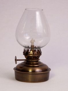 an old fashioned oil lamp on a white background