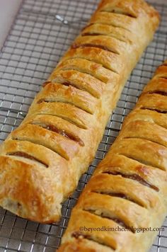 two pieces of bread sitting on top of a cooling rack