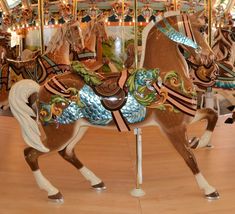 a merry go round with several horses on it