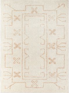 a white rug with an intricate design on the front and back side, in neutral tones