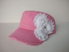 Super cute distressed pink army hat with white flowers and bling accent. This flattering hat features a velcro adjustable strap in the back. Perfect for wearing your hair down or in a ponytail. Thanks for looking! Handmade Pink Cap Hat, Adjustable Distressed Pink Hat, Distressed Pink Hat One Size, Pink Embroidered Spring Hat, Pink Cap With Patches, White Baseball Cap, Army Hat, Doll Hat, Light Turquoise