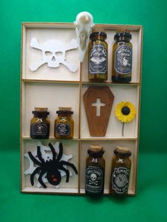 a wooden box filled with lots of different types of items on top of a green surface