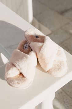 You asked and we listened! A shorter faux fur slipper is now available. Take a deep breath, pour yourself a cup of tea and cosy up with your favourite book. It's time to take a moment for yourself. Time is the new luxury and you deserve to make it all about you. Available in our four dreamy signature colours, the Sadie Slipper will keep your toes oh so cosy. Pair back with our sleepwear and robes for the ultimate getting ready combo. DETAILS: Made from a premium soft faux fur with crossover detail and high quality flexible sole. FABRIC COMPOSITION: Upper: 100% Polyester Lining: 100% Polyester Sole: TPR with textile flocking SIZE & FIT: Available in 3 sizes: S: Suits US shoe size 5-6 M: Suits US shoe size 7-8 L: Suits US shoe size 9-10 SHIPPING & DELIVERY: Orders will be dispatched in 3-5 b Bridesmaid Slippers, Bridal Slippers, Knit Slippers, Fluffy Slippers, Faux Fur Slippers, Fur Slippers, Knitted Slippers, A Cup Of Tea, Take A Deep Breath