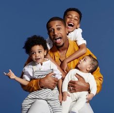 three adults and two children posing for the camera