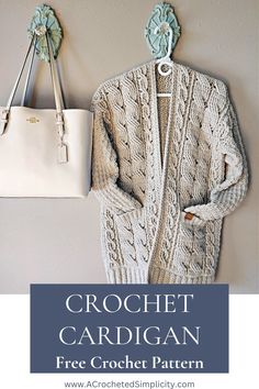 a crochet cardigan is hanging on the wall next to a handbag