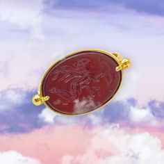 Elegant signet ring made of 14k of yellow gold with one natural brownish red agate (carnelian)engraved with a winged cupid with bow & arrow. Carnelian is the birthstone for the zodiac sign of Virgo. It is known for its soothing energy, spreads harmony and peace. Ring's size : 53.0 FR / 6 1/4 US.  Dimensions of the carnelian stone : 2.70 * 1.70 cm./ 1.6 * 0.63 inch. 14k solid gold carnelian ring carved with baby angel of love,  custom made in MELIGreece's workshop in Athens.  This ring is accompanied by an elegant packaging. We combine it with MELIGreece's two rows diamond 18k gold ring https://www.etsy.com/listing/1218507876/18k-yellow-gold-chevalier-ring-two-lines?click_key=4454654adacdc908834a2f03fb5e319b76f9b3e2%3A1218507876&click_sum=7497f14e&ga_search_query=Two%2Blines&ref=shop_items_ Valentines Jewellery, Angel Of Love, Valentine Gifts Jewelry, Bow Arrow, Carnelian Ring, Bow Arrows, Fine Ring, Gold Cross Necklace, Carnelian Stone