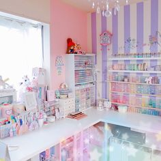 a room filled with lots of toys and decor on the walls next to a window