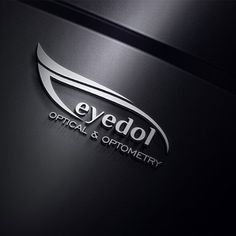 the logo for eyedol optical and optomery is shown on a black background