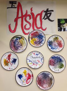 a group of paper plates sitting on top of a wall