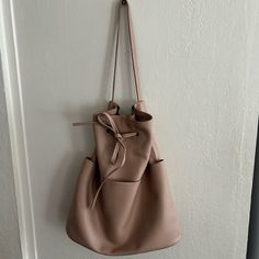 Nwt Super Soft Faux Leather With Great Functionality. Outside Pockets Are Really Convenient. Comfortable Shoulder Strap Makes It Easy To Wear. Color Is A Great Beige/Grey/Pinkish Hue. Don’t Miss Out On This Boho Style! Beige Soft Leather Bucket Bag For Errands, Everyday Bucket Bag Tote With Long Strap, Everyday Beige Bucket Backpack, Everyday Beige Bag With Long Strap, Drawstring Handbag, Orange Tote Bags, Leopard Purse, Vegan Leather Tote Bag, Oak And Fort