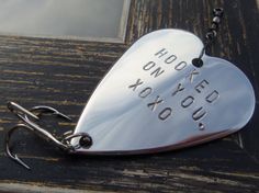 a metal heart shaped keychain that says rock on, yoked to you