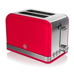 a red toaster sitting on top of a white table