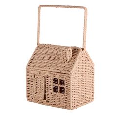 a wicker basket with a house on it