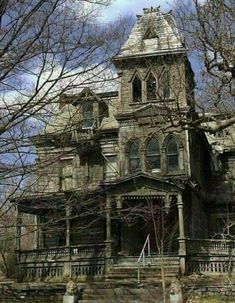 an old house is shown in the woods