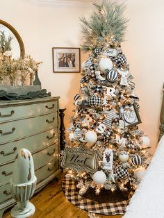 a decorated christmas tree in a bedroom