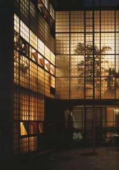 a building with lots of windows lit up by lights on the outside and in the inside