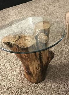 a wooden table with glass top on carpeted floor