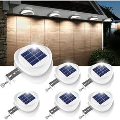 six solar powered lights on the side of a house