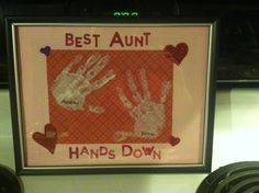 handprints are displayed in front of a sign that says, best aunt hands down