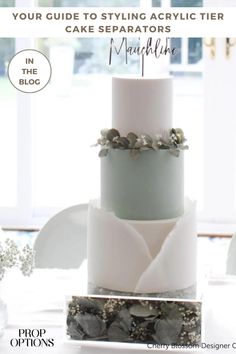 a three tiered cake sitting on top of a table next to a window with the words your guide to styling acrylic tier cakes