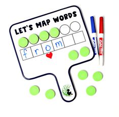 a green and white paper with words on it next to two markers that read, let's map words from