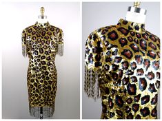 "Here's another fun and fabulous vintage dress fully embellished with sequins and beading featuring a leopard print design. It's in excellent condition! Bust - 38/40\" Waist - 32/34\" Hips - 40/42\" Length - 37\" + 5\" fringe beading Tag Size - XL (please refer to measurements) This dress comes from a pet-free and smoke-free home. If you would like more info or have any questions, please don't hesitate to ask!" Festive Fitted Sequin Dress For Costume Party, Vintage Fitted Sequin Embellished Dress, Vintage Fitted Sequin Dress For Summer, Vintage Embellished Sequin Summer Dress, Vintage Embellished Sequin Dress For Summer, Vintage Summer Embellished Sequin Dress, Vintage Fitted Sequin Dress For Costume Party, Fitted Vintage Sequin Dress For Costume Party, Vintage Sequin Dress For Summer