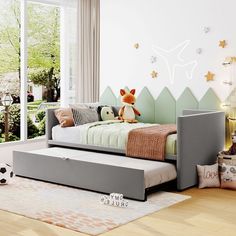 a child's bedroom with a bed and toys