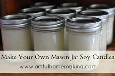 mason jars filled with white liquid sitting on top of a wooden table