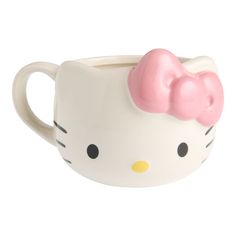 a hello kitty mug with a pink bow on it