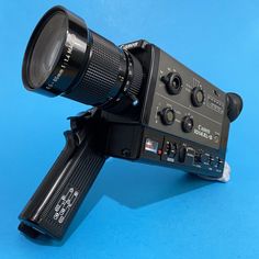 a close up of a camera on a blue background