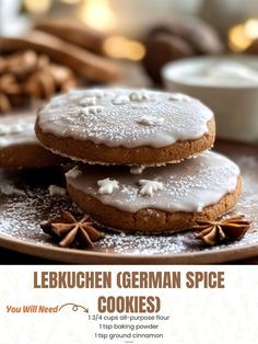 three cookies on a plate with white icing and cinnamon sprinkles around them