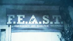 there is a sign with the words feast emergency aid shelter training on it's side