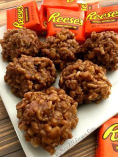 some cookies and candy bars on a plate