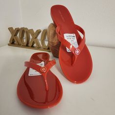 Blood Orange Jellies Tan Flip Flops For Summer, Tan Round Toe Flip Flops For Summer, Tan Round Toe Sandals For Beach, Tan Flat Sandals For Beach, Casual Tan Flip Flops For The Beach, Tan Open Toe Flip Flops For The Beach, Tan Flat Flip Flops For Vacation, Tan Vacation Flip Flops, Tory Burch Sandal