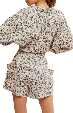 These floral-print knit pajamas featuring a high-low button-up top and drawstring shorts are cut from pure cotton to keep you cool all night long. Top: 25 1/2" front length; 30" back length (size Medium) Bottoms: 3" inseam; 27" leg opening; 13 1/2" front rise; 17 1/2" back rise (size Medium) Top has spread collar; long sleeves 100% cotton Machine wash, tumble dry Imported Spring Loungewear Sleepwear With Pockets, Spring Sleepwear With Pockets For Loungewear, Summer Floral Print Beige Sleepwear, Summer Cotton Pajama Shorts With Floral Print, Spring Cotton Sleepwear Shorts, Spring Cotton Short Sleepwear, Beige Floral Print Sleepwear For Summer, Spring Floral Print Pajama Shorts For Pajama Party, Chic Spring Sleepwear